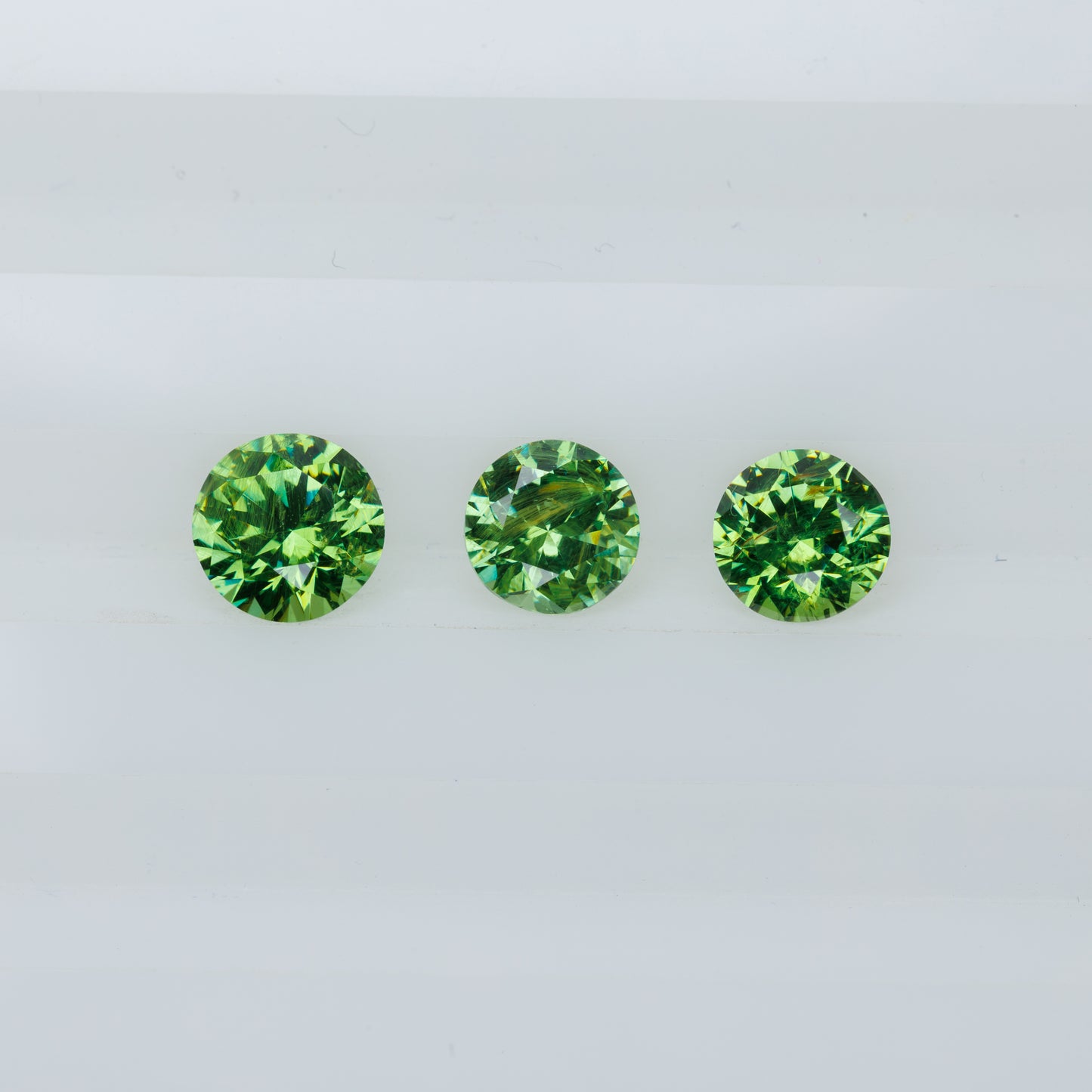 Russian demantoid set, faceted demantoid garnet set 1,64 ct