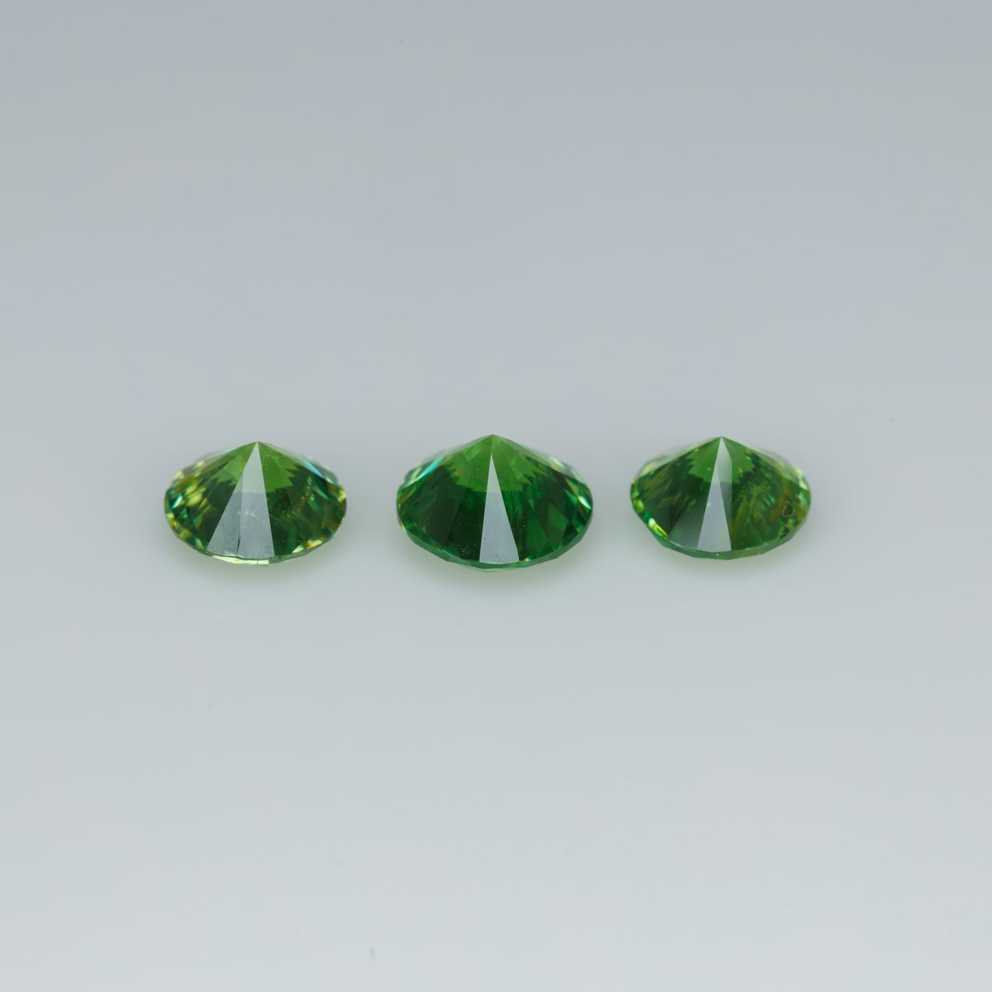 Russian demantoid set, faceted demantoid garnet set 1,64 ct