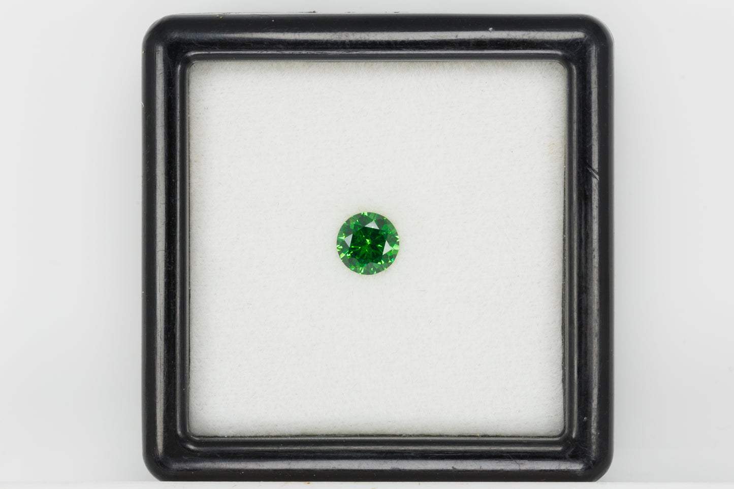 Certified vivid green faceted demantoid garnet, 0.62 ct