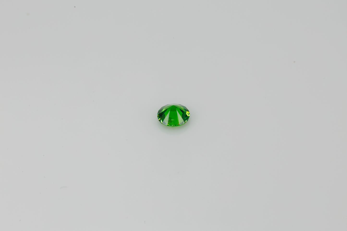 Certified vivid green faceted demantoid garnet, 0.62 ct