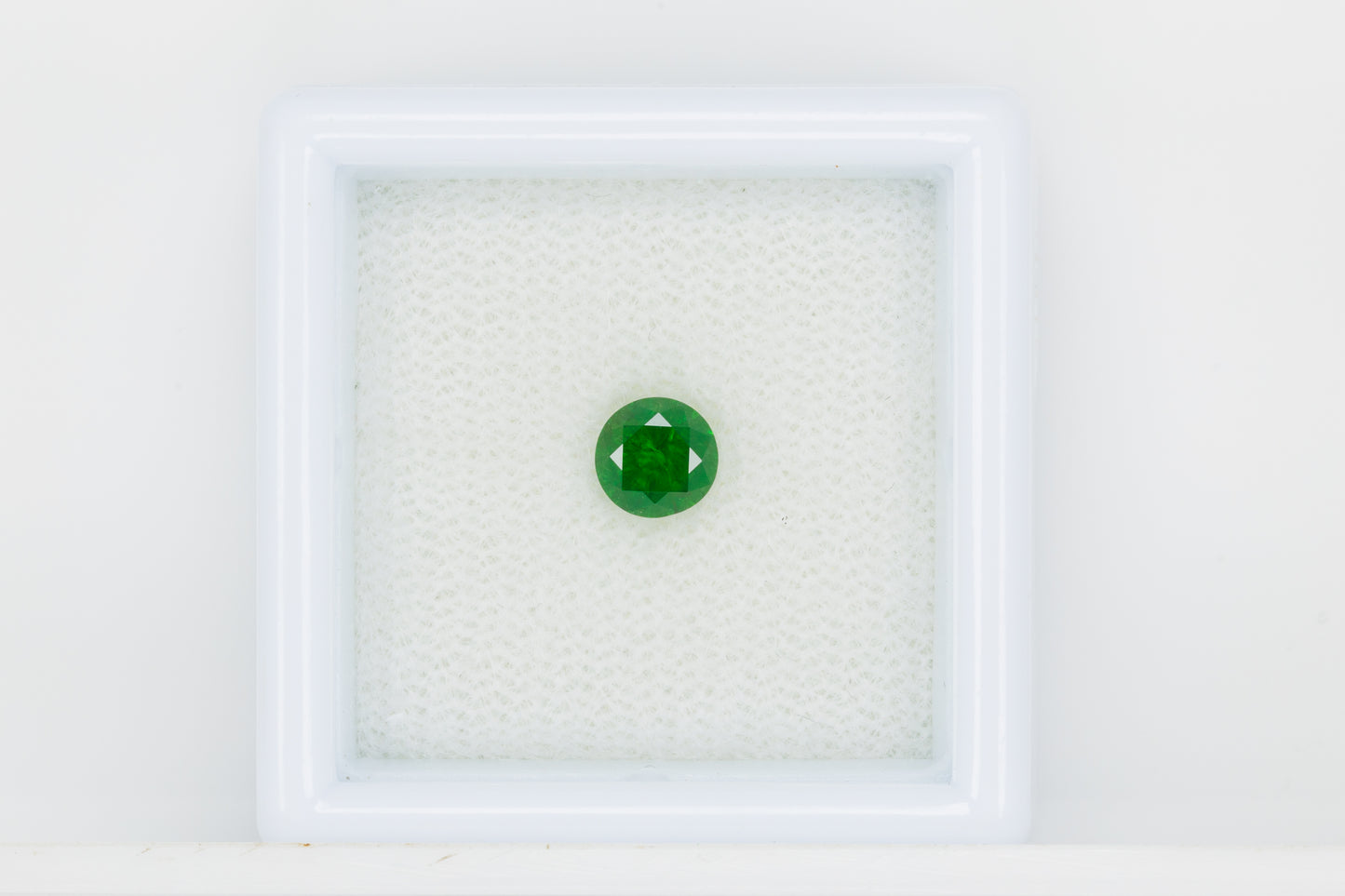 Vivid emerald green faceted demantoid garnet, 0.56 ct