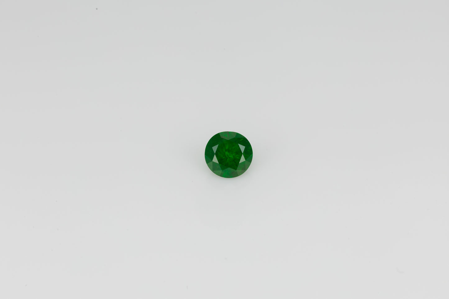 Vivid emerald green faceted demantoid garnet, 0.56 ct