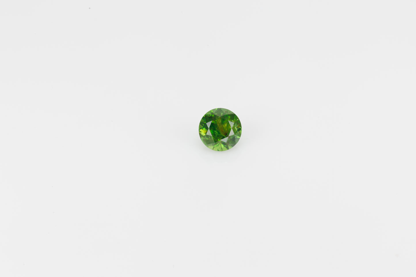 Vivid green faceted demantoid garnet, 0.65 ct