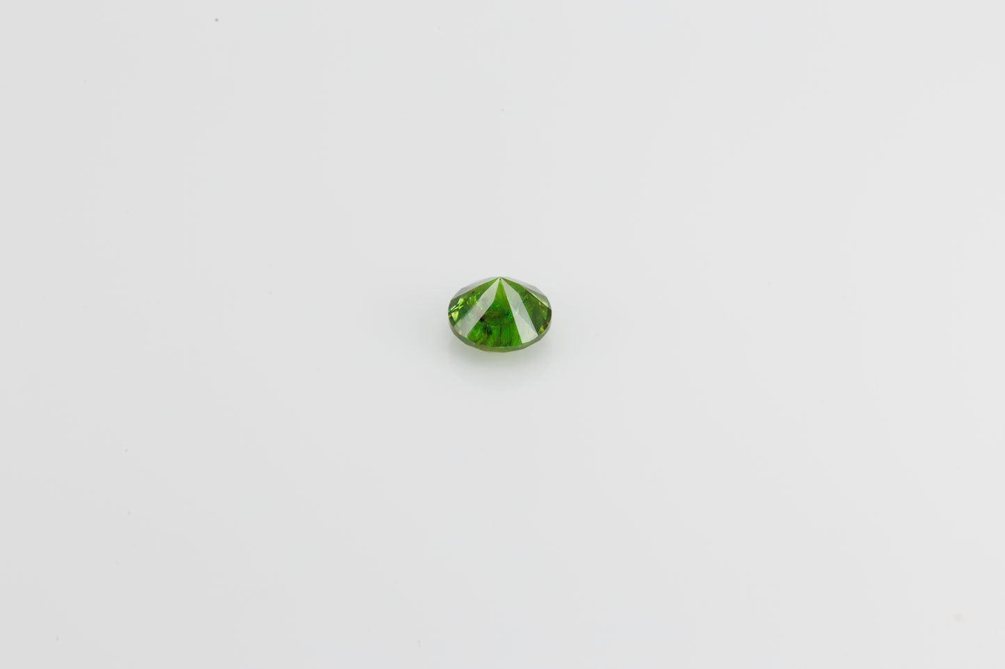Vivid green faceted demantoid garnet, 0.65 ct