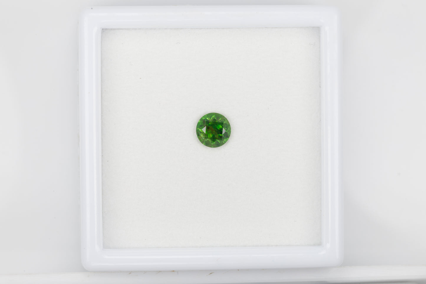 Vivid green faceted demantoid garnet, 0.65 ct