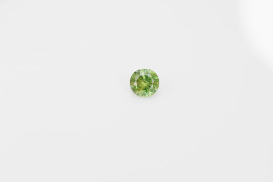 Yellowish green faceted demantoid garnet, 0.65 ct