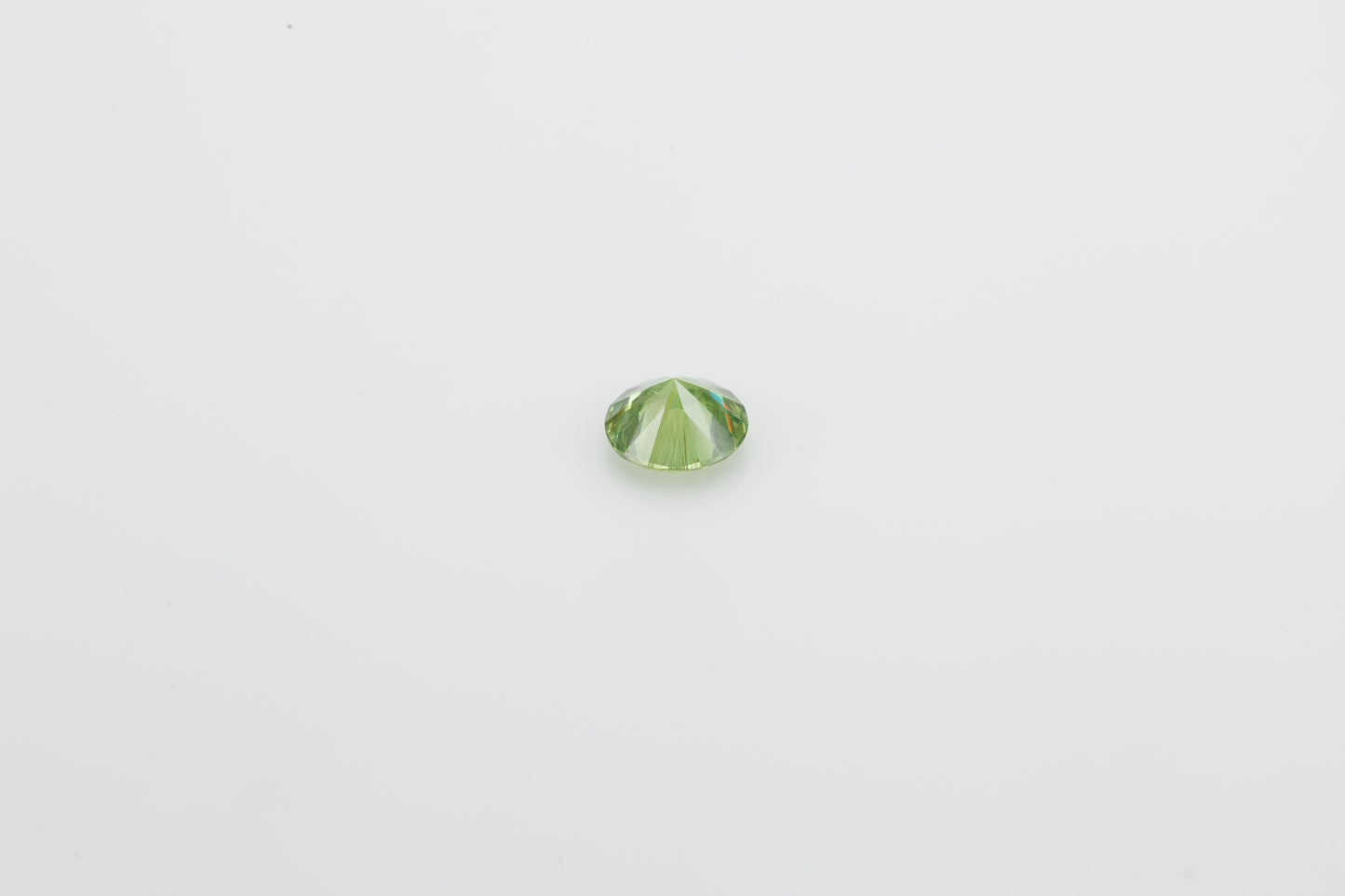 Facted demantoid garnet with obvious horsetail inclusion, 0.53 ct