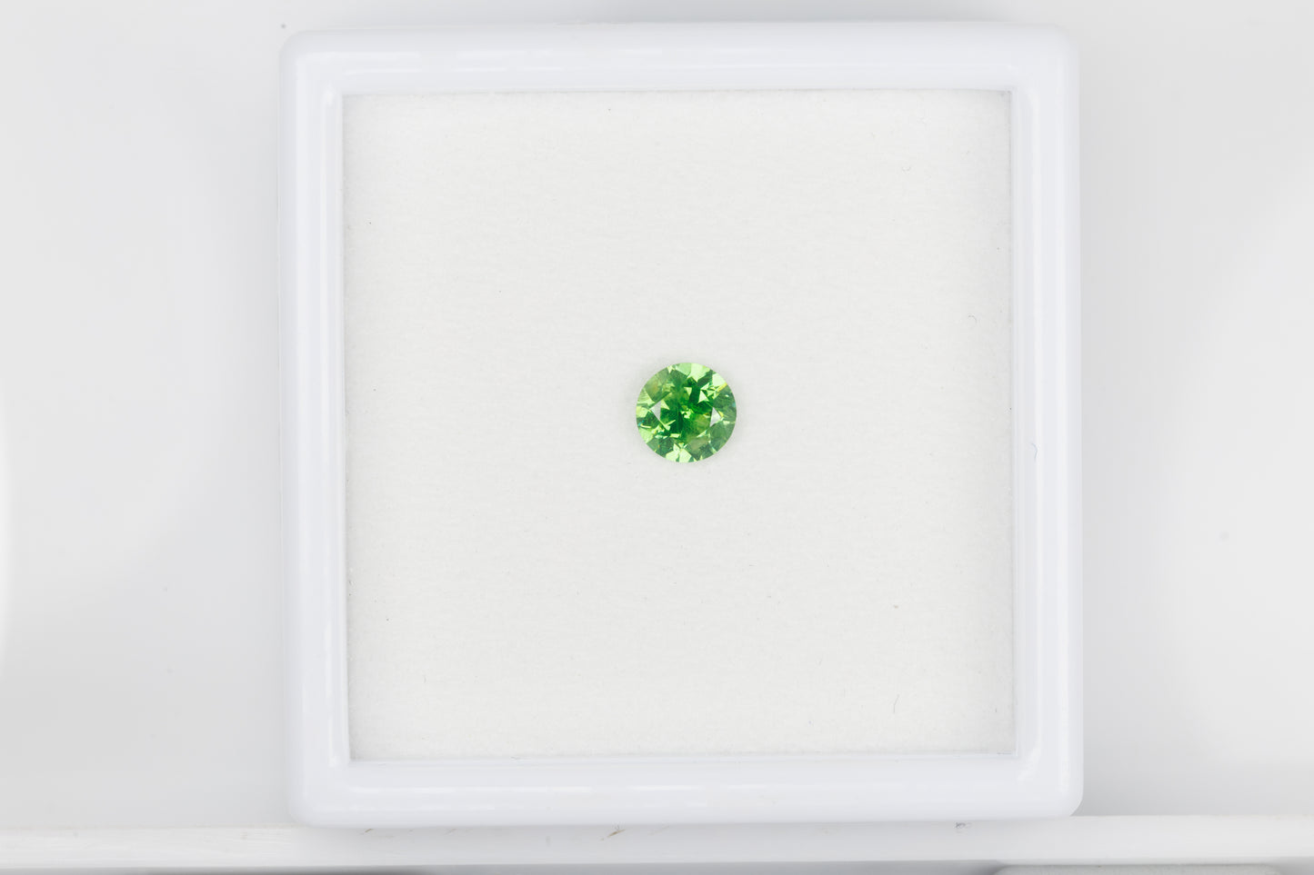 Faceted demantoid garnet with good color and dispersion, 0.46 ct