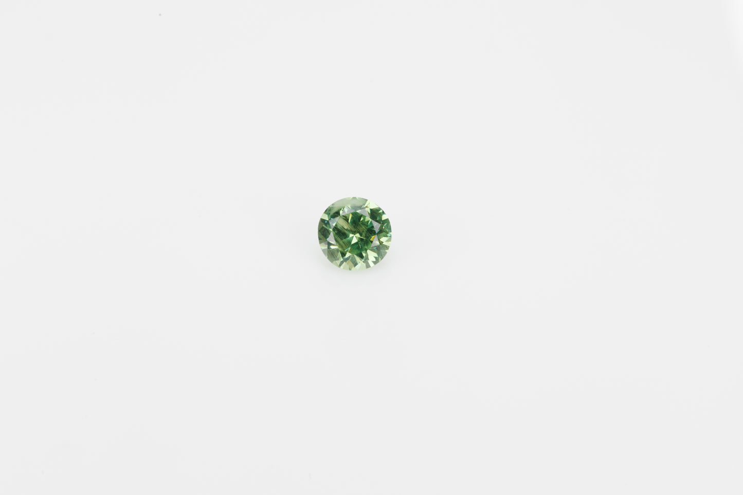 Faceted demantoid garnet, 0.5 ct