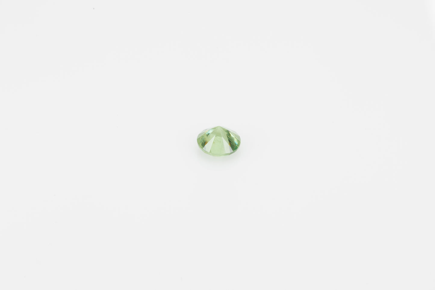 Faceted demantoid garnet, 0.5 ct