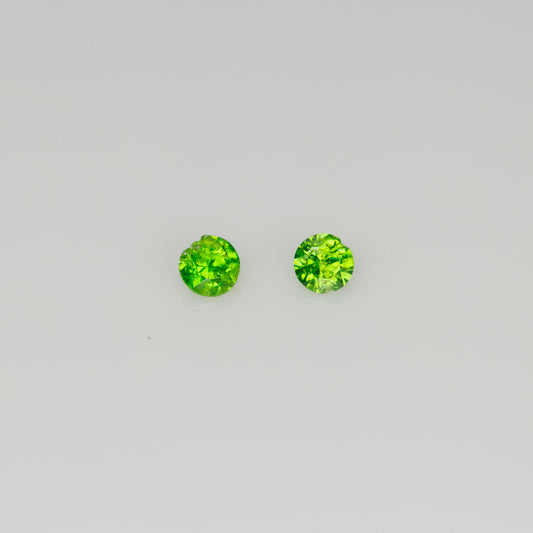 Faceted Russian demantoid garnet pair, 0.11 ct