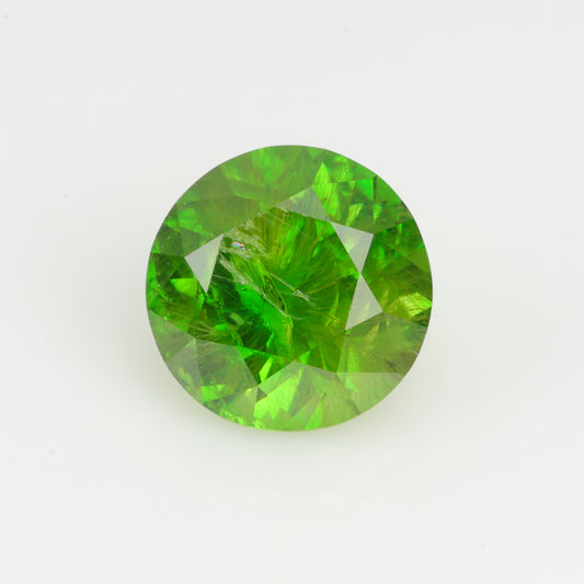 0.76 ct, Faceted Russian demantoid garnet with horsetail byssolite inclusions