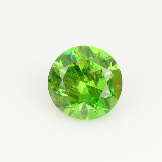 0.63 ct, Faceted Russian demantoid garnet with horsetail byssolite inclusions