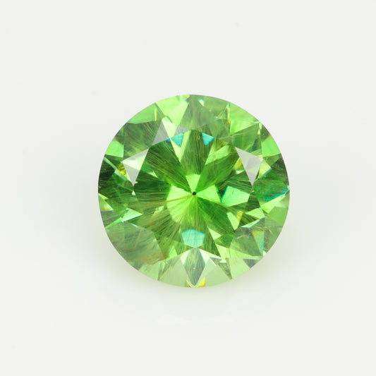 0.52 ct, Faceted Russian demantoid garnet with firework horsetail inclusions