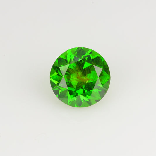 0.22 ct, Faceted Russian demantoid garnet high with horsetail inclusion