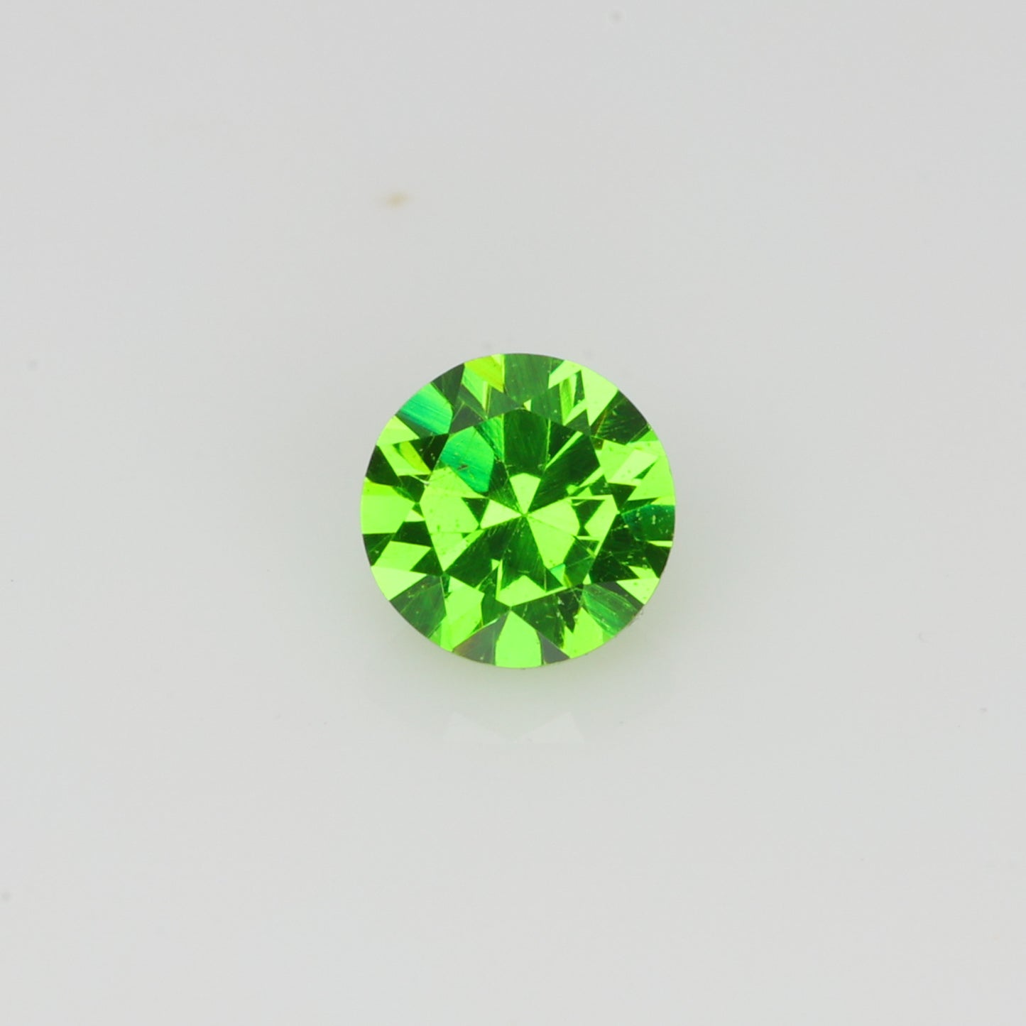 0.14 ct, Faceted Russian demantoid garnet high dispersion