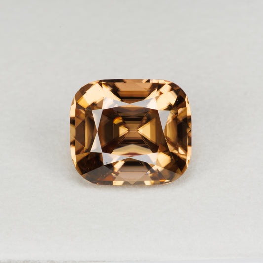 5.94 cts, Facted yellowish orange zircon cushion shape, perfect cut