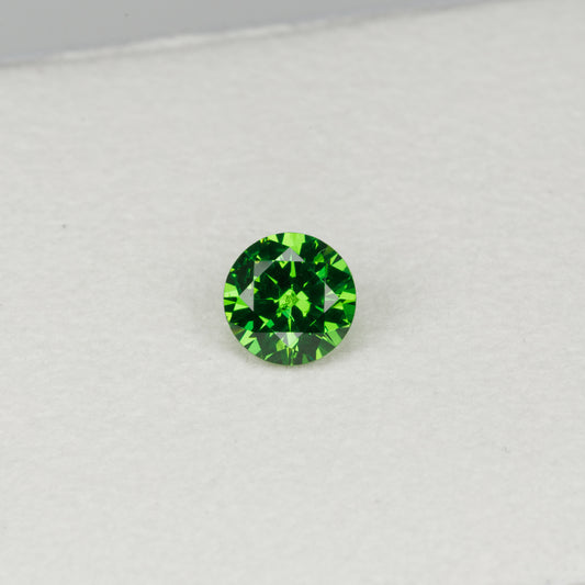 0.6 cts, Faceted vivid green Rusisan demantoid garnet