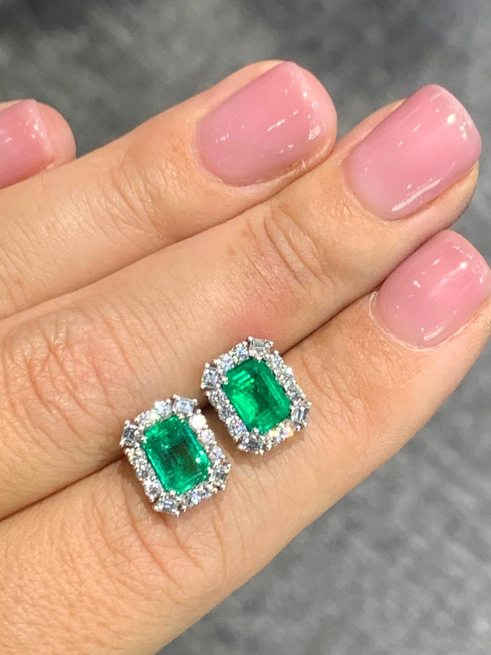 Gold earrings with faceted emeralds and diamonds
