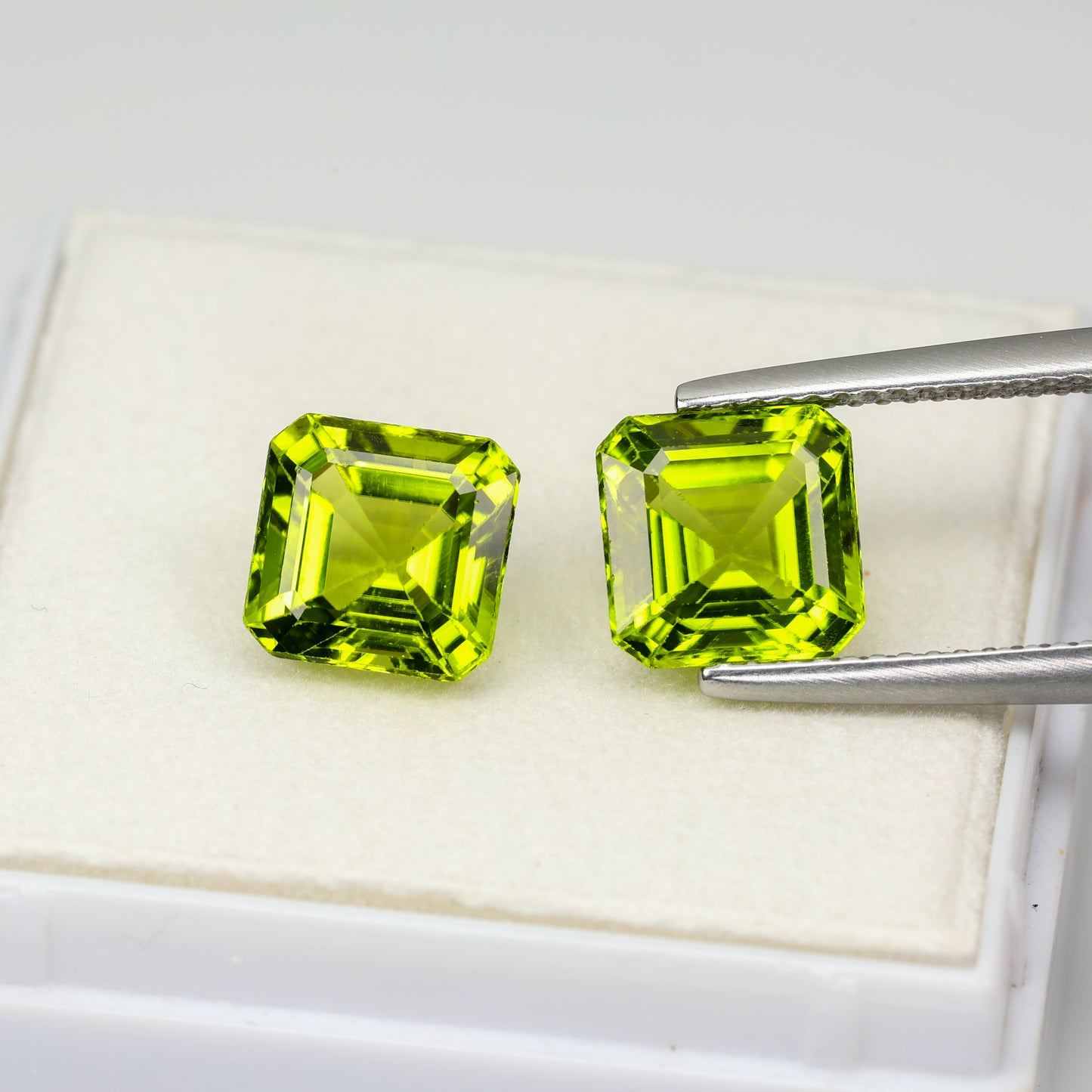 Faceted asher cut peridot pair, 5.45 cts