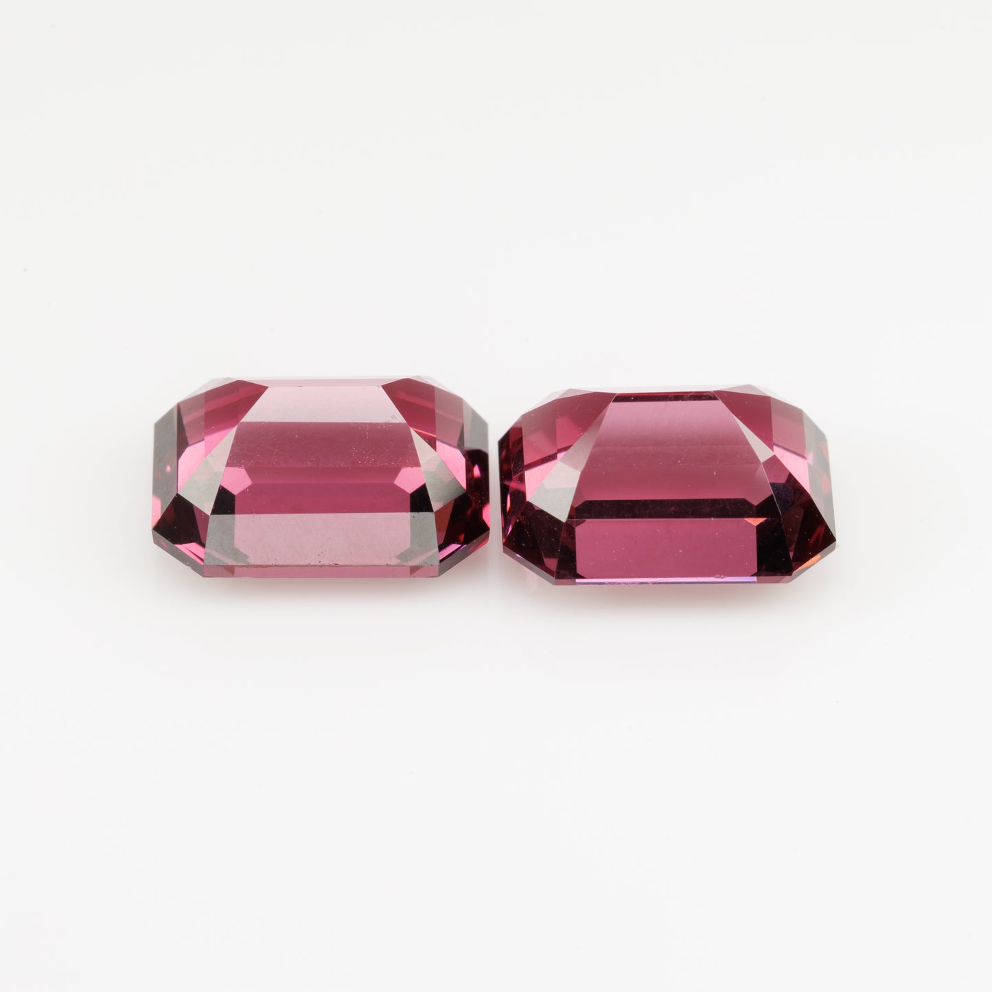 Faceted octagon pink garnet pair, 8.1 cts