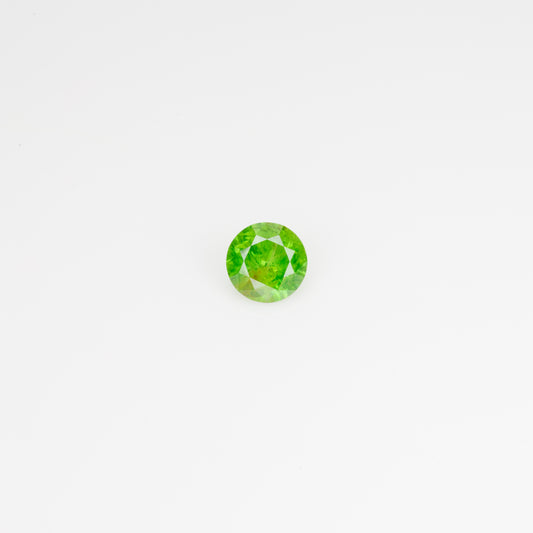 0.5 ct, Faceted Russian Demantoid with bissolite inclusions