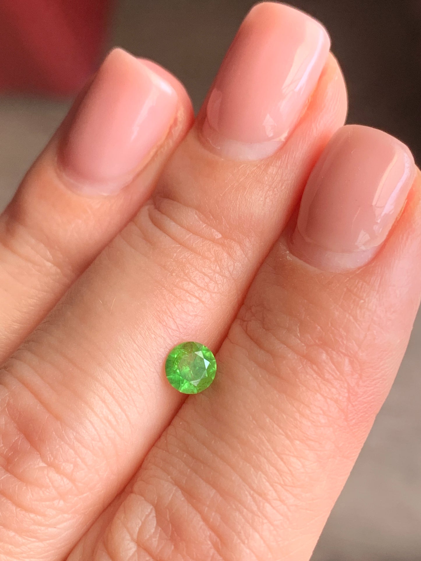 0.5 ct, Faceted Russian Demantoid with bissolite inclusions