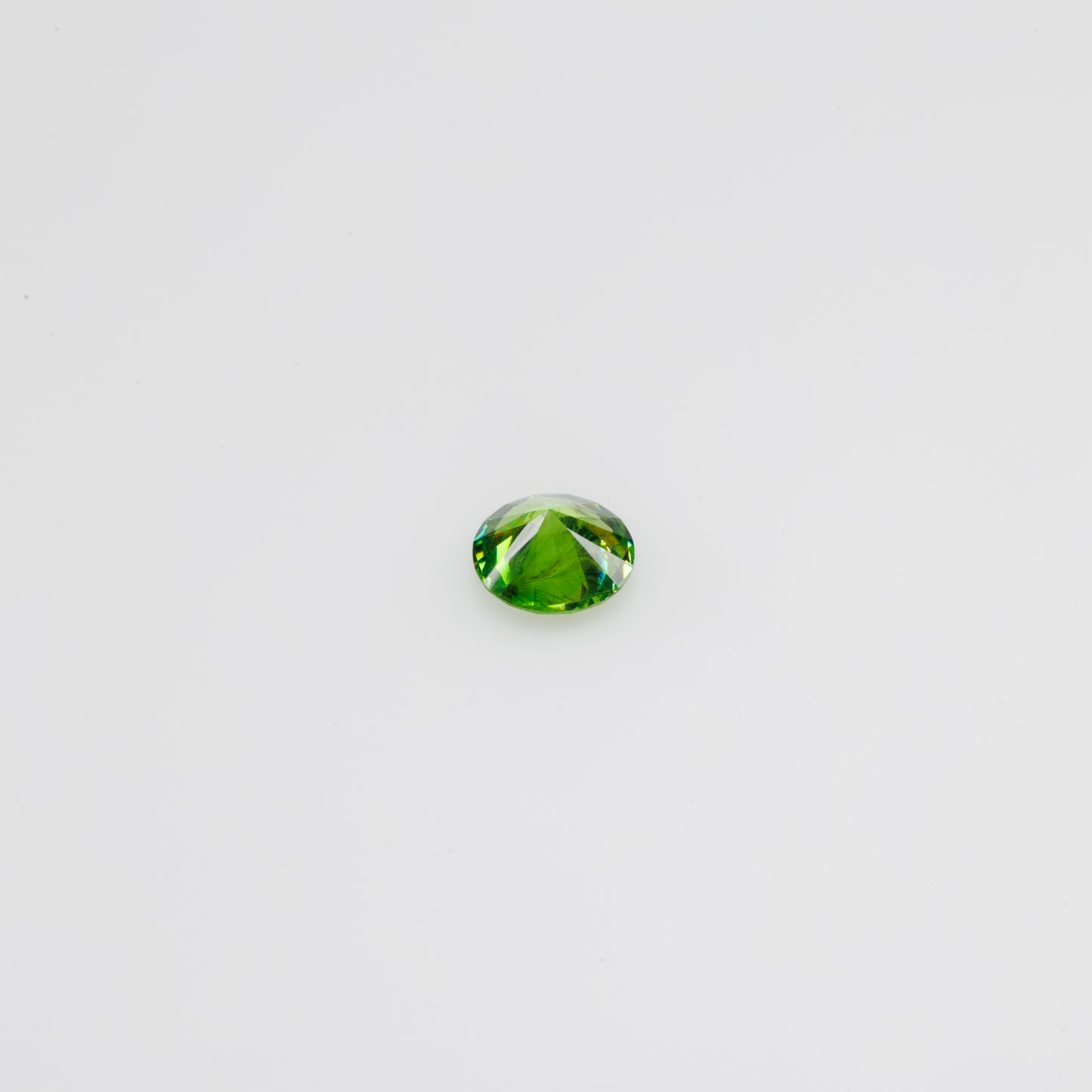 0.44 ct, Faceted Russian Demantoid with bissolite inclusions