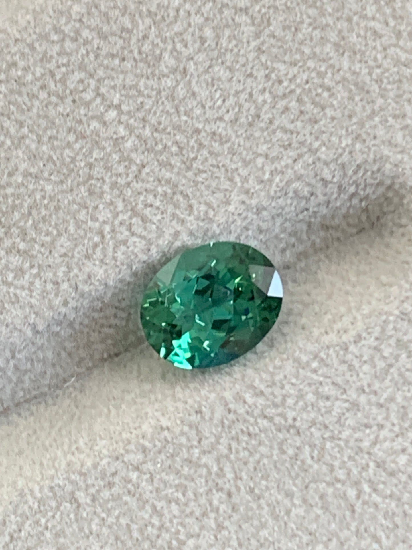 Faceted bluish green oval tourmaline