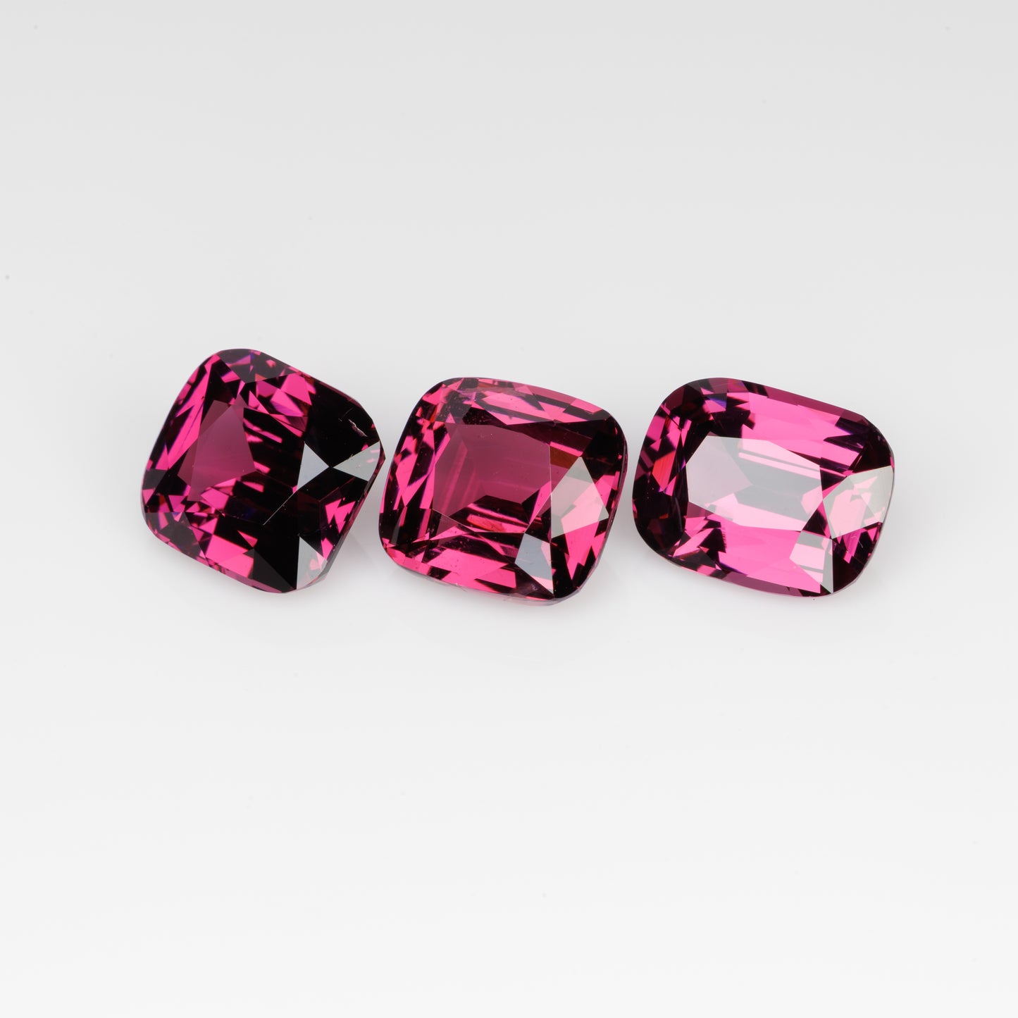 10 cts, Faceted rhodolite garnet cushion set the pair's