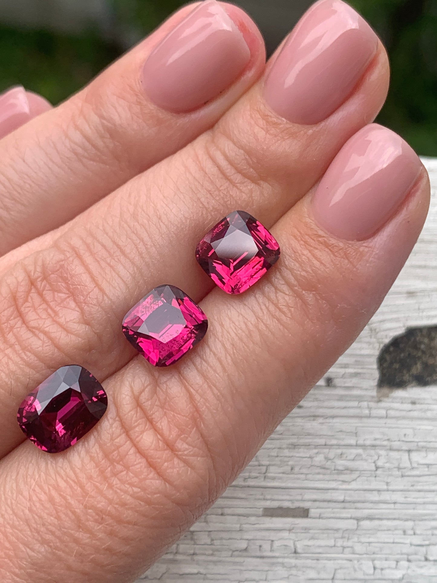 10 cts, Faceted rhodolite garnet cushion set the pair's