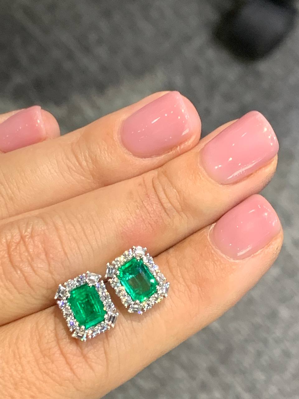 Gold earrings with faceted emeralds and diamonds