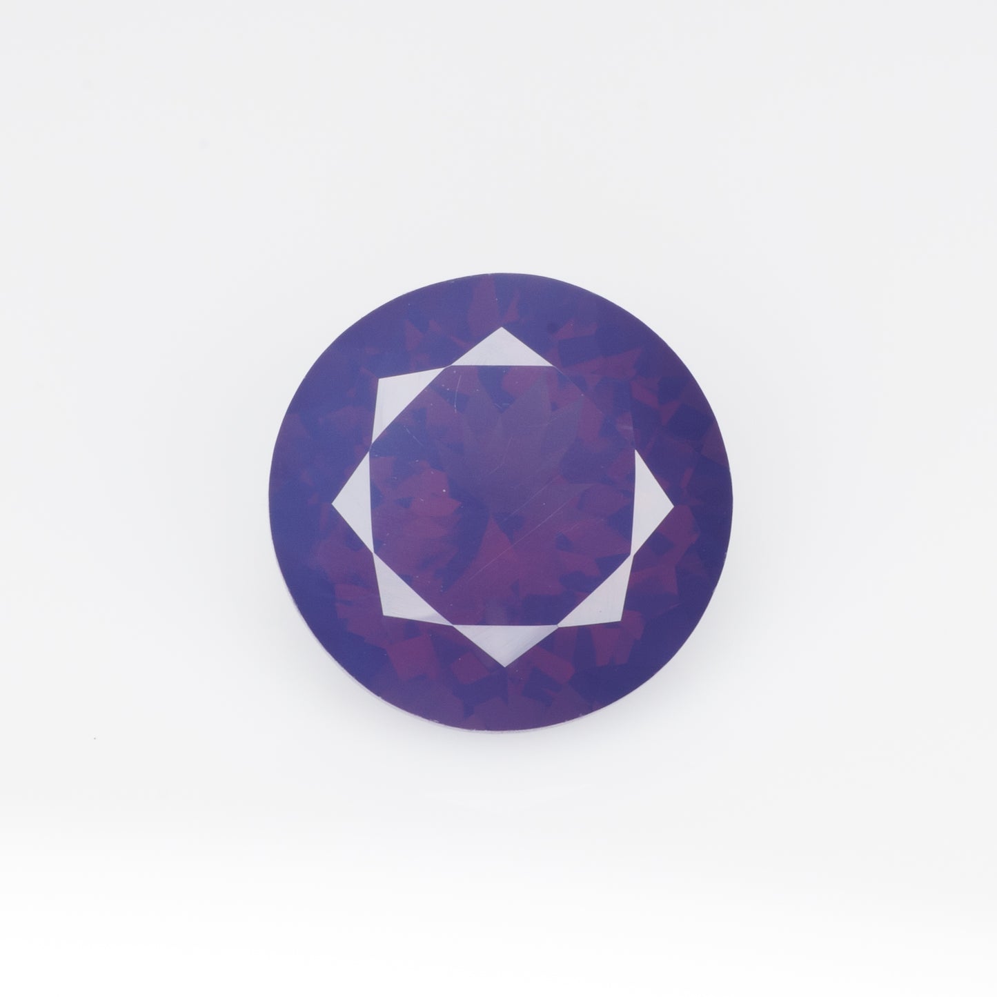 3.96 cts, Pinkish purple milky faceted round spinel, very unusual color