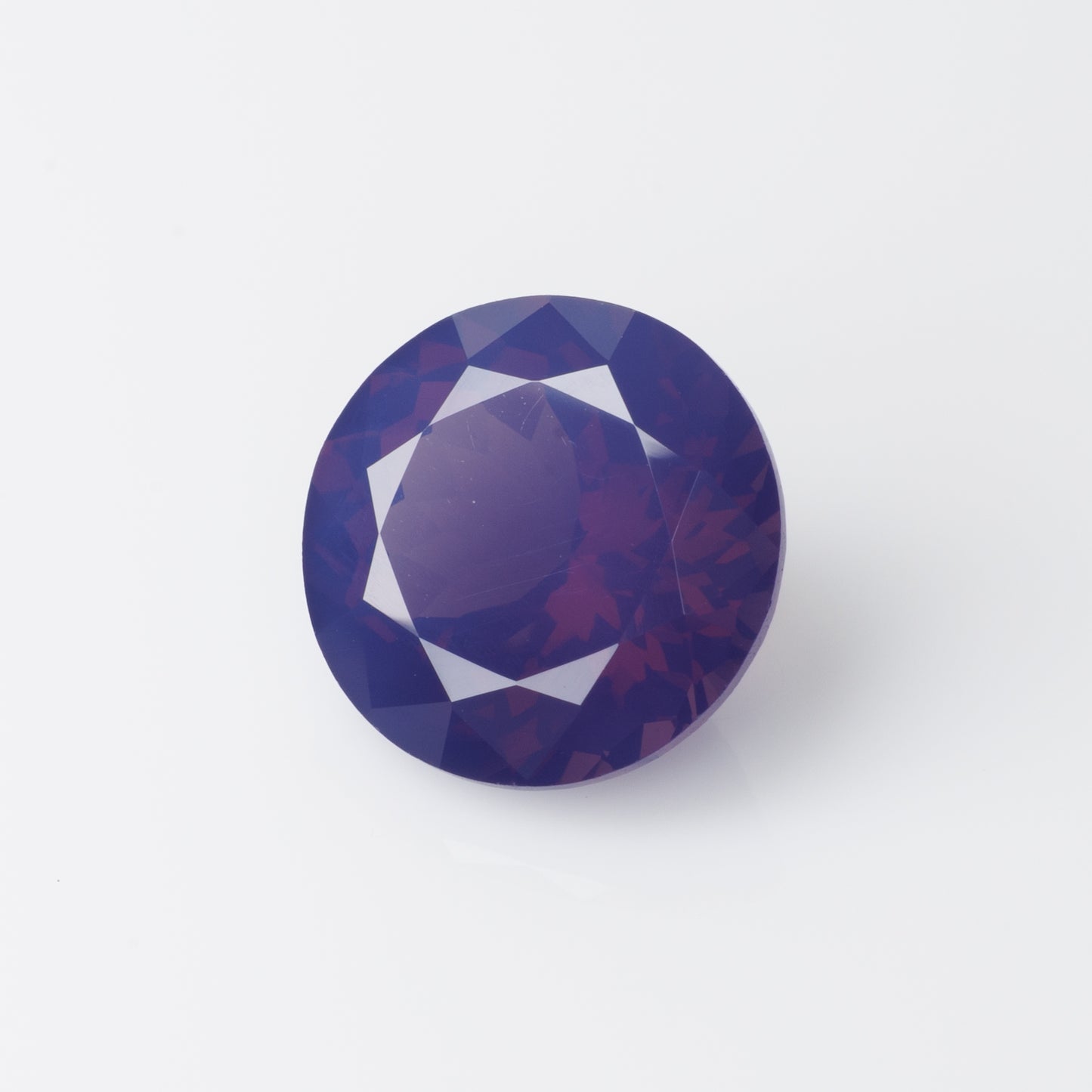3.96 cts, Pinkish purple milky faceted round spinel, very unusual color