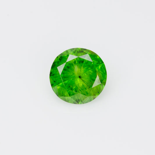 0.52 cts, Russian demantoid garnet with obvious horsetail inclusion