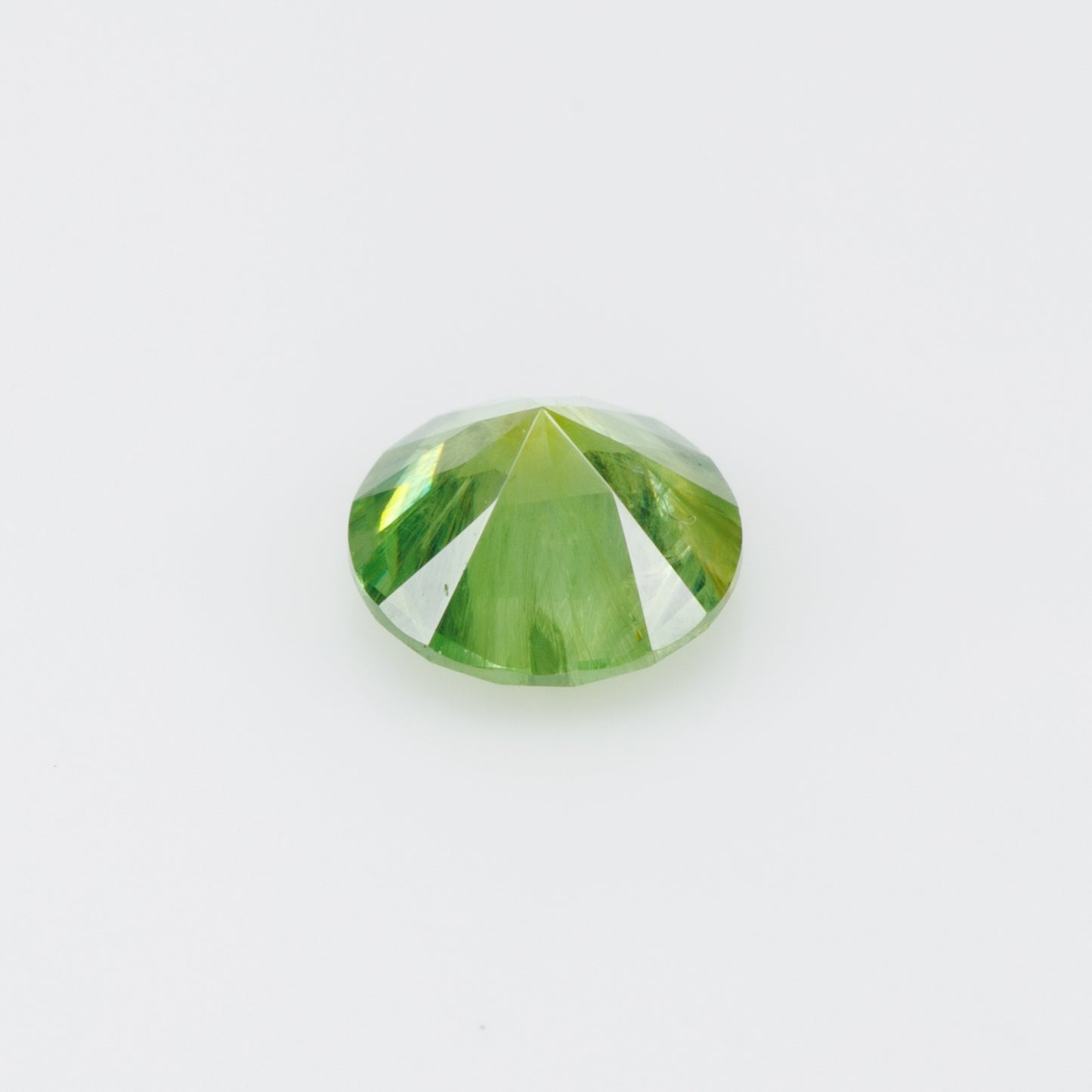 0.55 ct, Russian demantoid garnet with bissolite inclusions