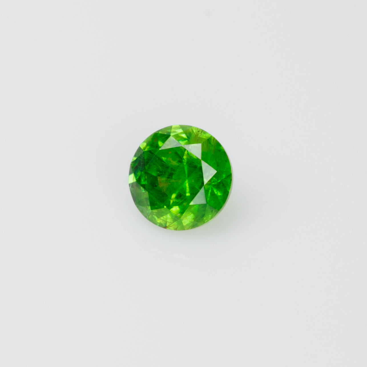 0.22 ct, Russian demantoid garnet with bissolite inclusions
