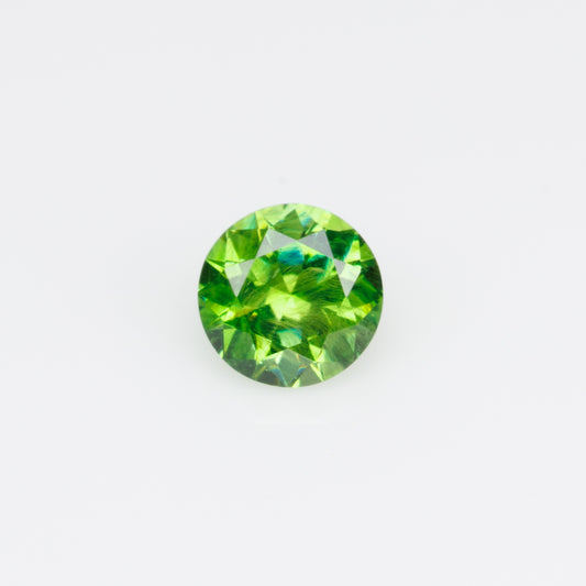 0.26 ct, Russian demantoid garnet with bissolite inclusions