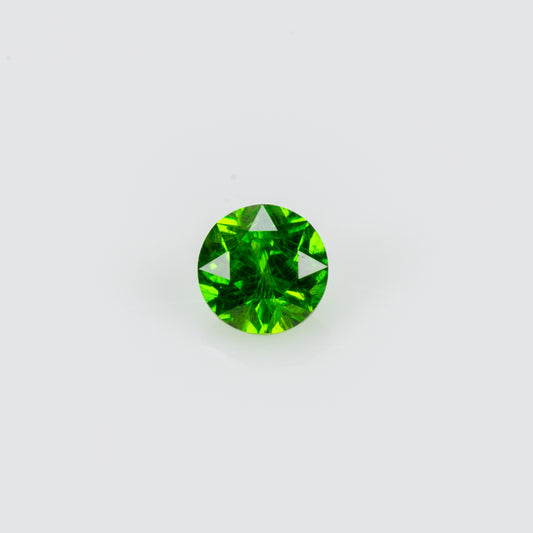 0.075 ct, Tiny vivid green faceted Russian demantoid garnet