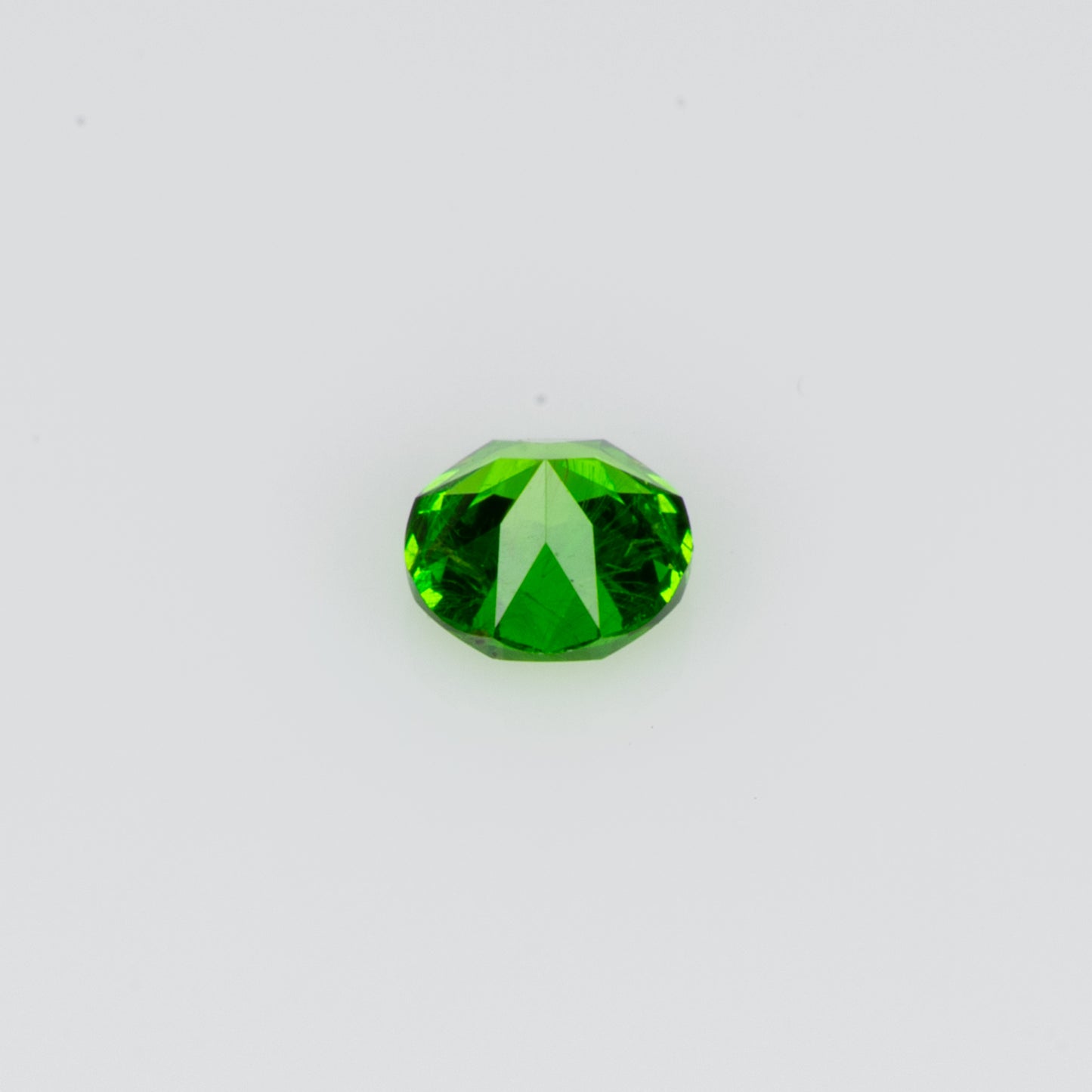 0.075 ct, Tiny vivid green faceted Russian demantoid garnet