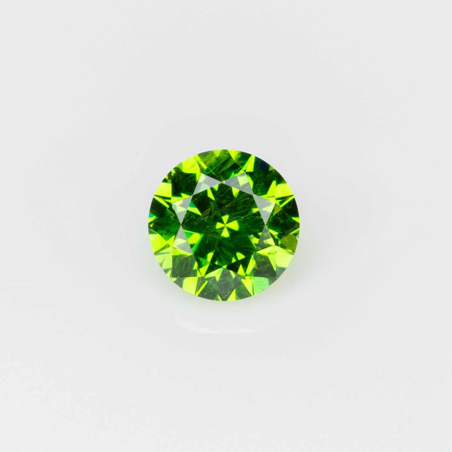 0.14 ct, Tiny vivid green faceted Russian demantoid garnet