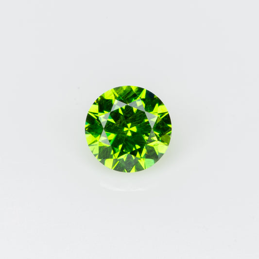 0.14 ct, Tiny vivid green faceted Russian demantoid garnet