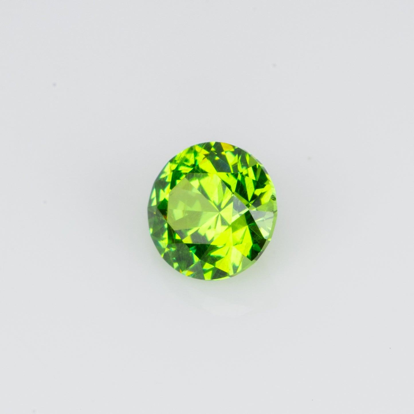 0.14 ct, Tiny vivid green faceted Russian demantoid garnet