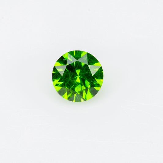 0.14 ct, Tiny vivid green faceted Russian demantoid garnet