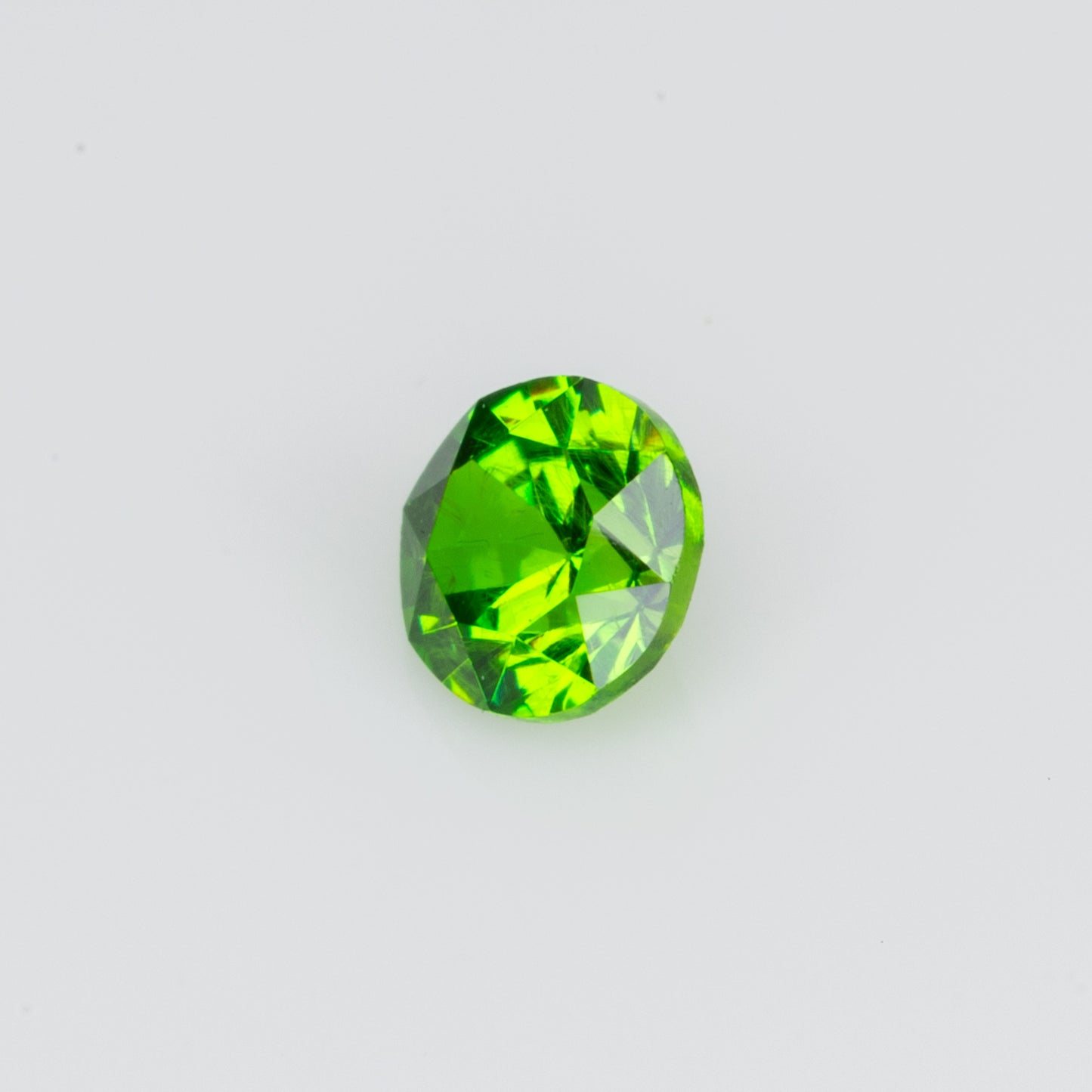 0.14 ct, Tiny vivid green faceted Russian demantoid garnet