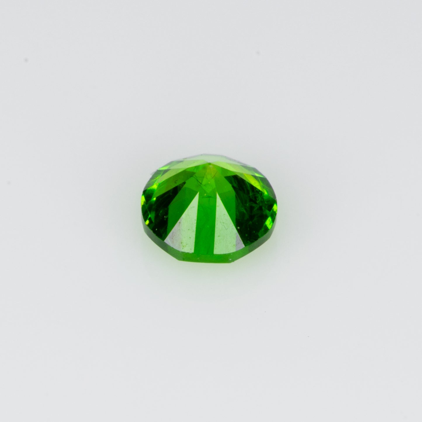 0.14 ct, Tiny vivid green faceted Russian demantoid garnet