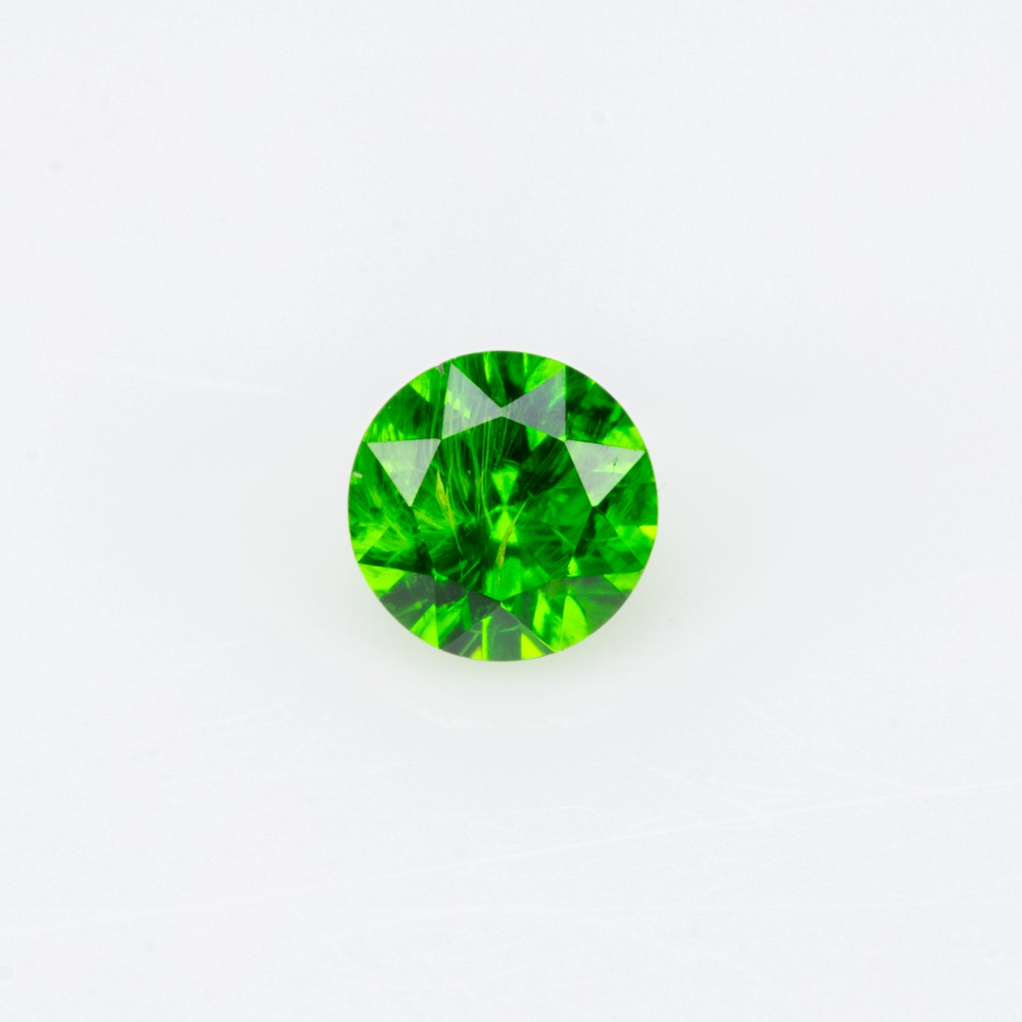 0.12 ct, Tiny vivid green faceted Russian demantoid garnet