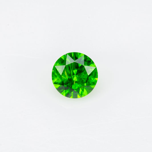 0.12 ct, Tiny vivid green faceted Russian demantoid garnet