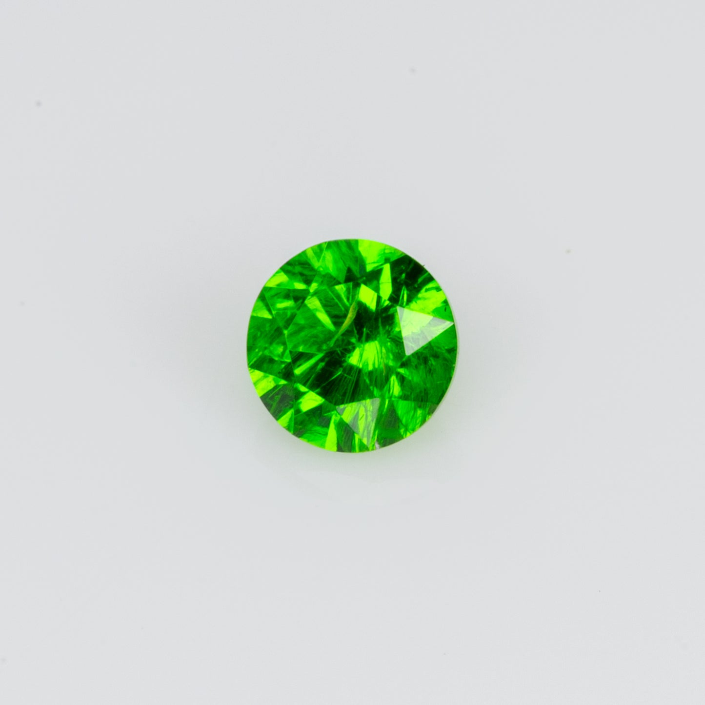 0.12 ct, Tiny vivid green faceted Russian demantoid garnet