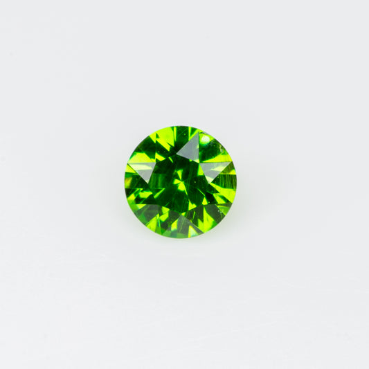 0.10 ct, Tiny vivid green faceted Russian demantoid garnet